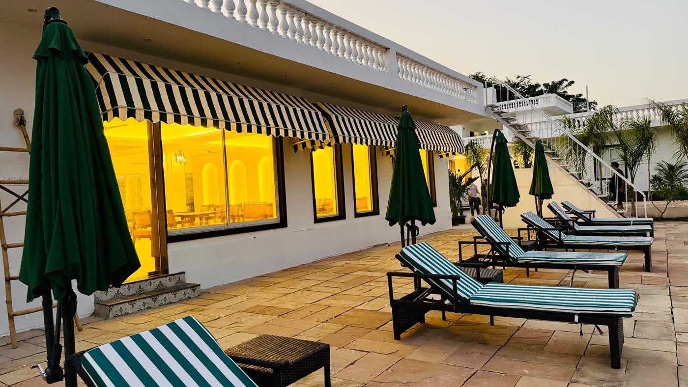 Striped awnings and loungers on the pool deck