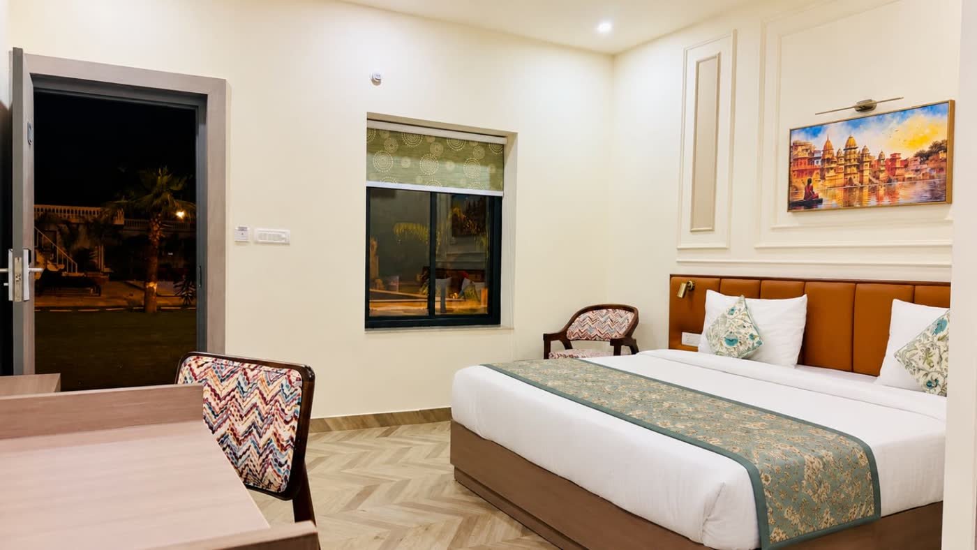 Guest room with a king bed opening onto the lawn